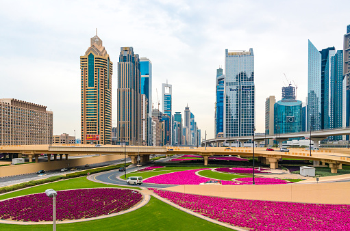 Dubai, UAE - March, 15. 2019 - futuristic skyscrapers, one different from the other, along the famous Sheikh Zayed Road in Dubai. Along the road is a partially ten-lane highway