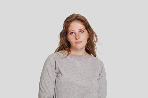 istock Sad woman looking at camera 1596212550