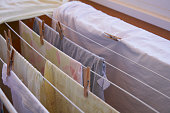 Closeup of clothes hung with clothes pegs on a clothesline