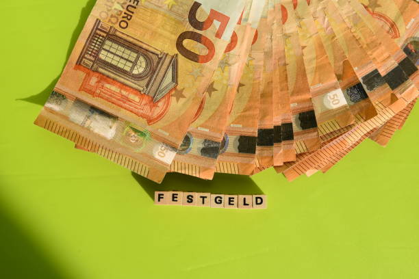 istock the german word for fixed deposit and euro bank notes 1596238882