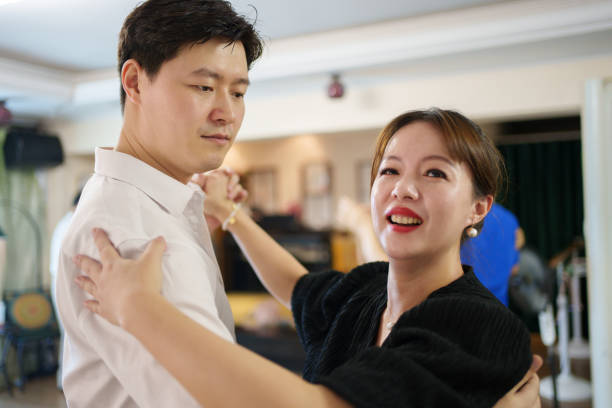 istock man and woman dancing together 1596304497