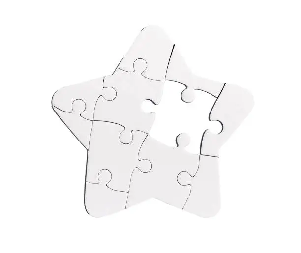 Photo of Star shaped puzzle with missing lacking piece isolated on white background