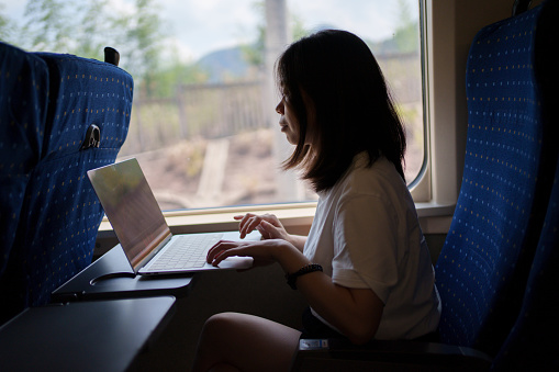 woman surfing the internet on the high-speed train