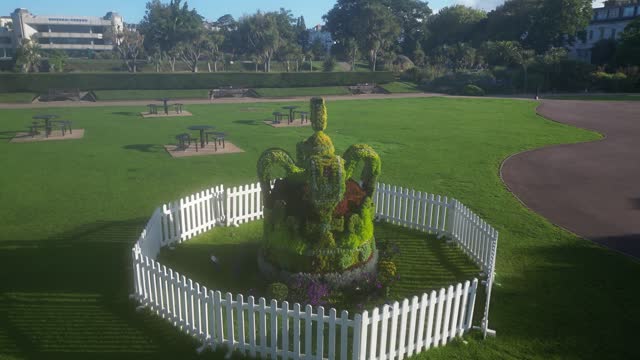 Torquay, Torbay, South Devon, England: DRONE VIEW: A Topiary Crown celebrating King Charles III's coronation on 6th May, 2023 (Clip 3)