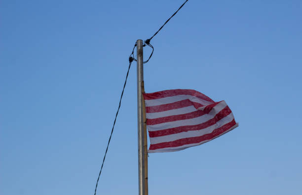 istock The flag flutters because of the strong wind 1596399431