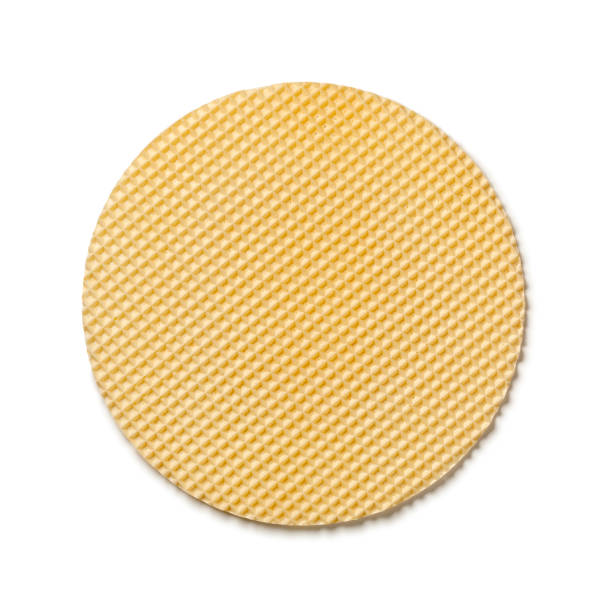 istock Single fresh round Polish waffle tortowe on white background close up 1596405292