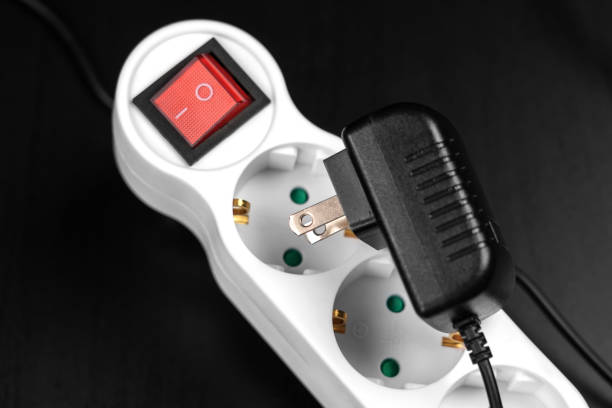 Failure to connect different incompatible American electrical plug and  European splitter socket in travel close up