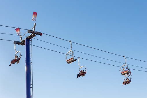 Fairgoers enjoy a ski lift ride at the Arizona State Fair.
