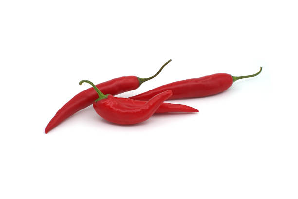 istock Group of red chili peppers isolated on white 1596430089