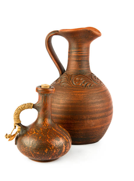 istock Ceramic amphora and small pitcher isolated on white . Vertical photo. 1596449275