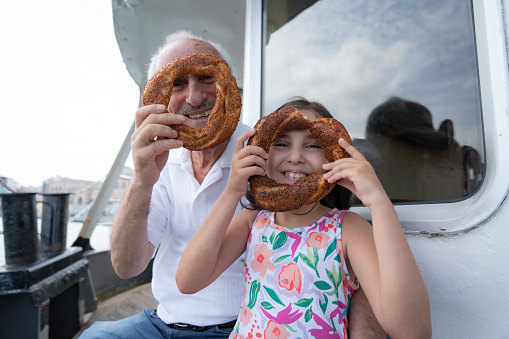 Grandfather and grandchild traveling on a ferry boat