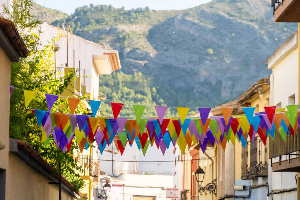 istock Colorful flags village street celebration 1596469079