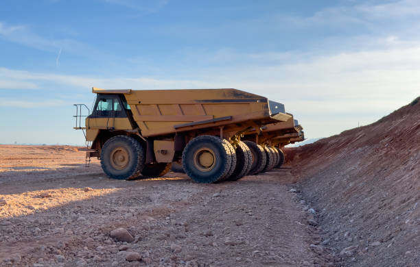 istock Mining truck in open-pit mining. Construction equipment on soil transport. 1596476922