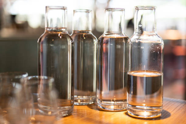 istock empty clean glass decanters for water in a restaurant on a bar counter 1596476959