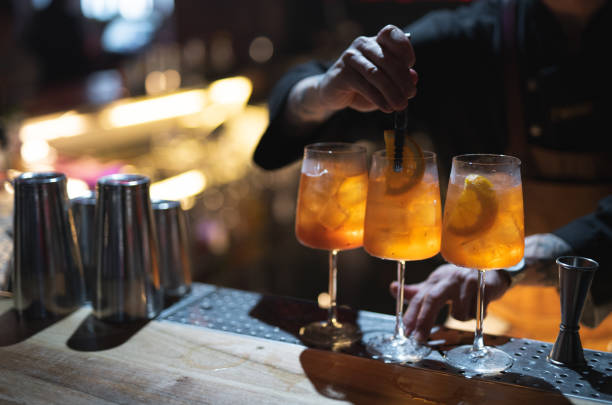 istock the bartender prepares a beautiful alcoholic cocktail at the bar counter 1596480326