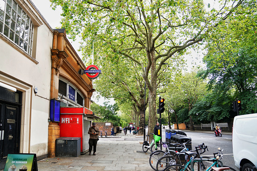 Holland Park Avenue stock photo. Holland Park Avenue is a main street located in the Royal Borough of Kensington and Chelsea, in west central London.\n\nThe Holland Park Avenue street runs from Notting Hill Gate in the east to the Holland Park Roundabout in the west, forms a part of the old west road connecting the cities London with Oxford and the west of England, and is designated part of the A402 road.