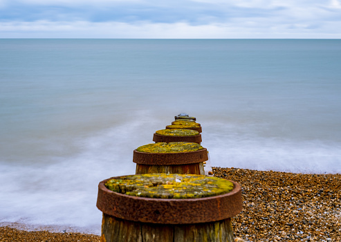 A mid day long exposure shot of a groyne in Eastbourne