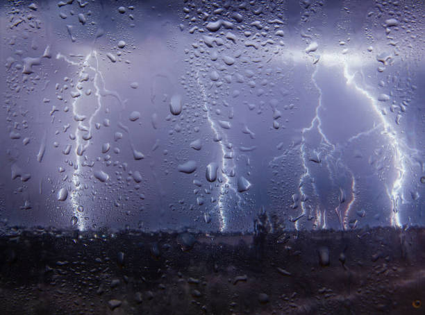 Outside the window bad weather lightning, rain and wind, view from the window