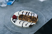 Apple strudel with whipped cream and chocolate sauce