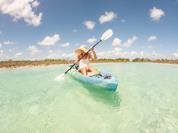 istock Woman canoeing on tropical lagoon in Mexico 1596601576