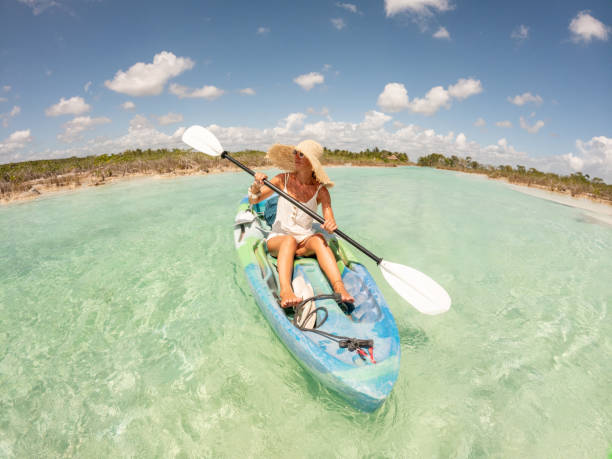 istock Woman canoeing on tropical lagoon in Mexico 1596602244