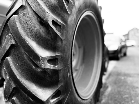 Close up of a large tractor wheel and tyre