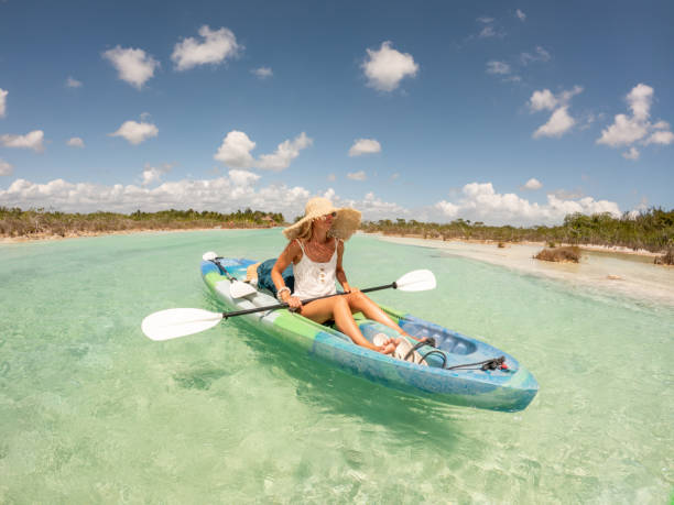 istock Woman canoeing on tropical lagoon in Mexico 1596610892
