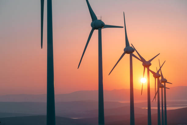 istock Scenic view of windmill farm at sunset time 1596620001