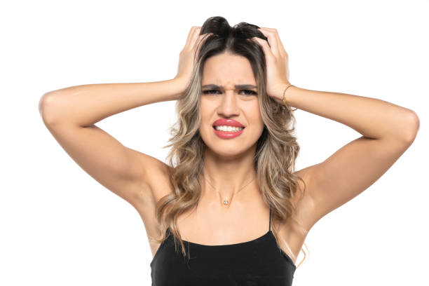 istock Young woman scratching head on white background. Annoying itch 1596623276