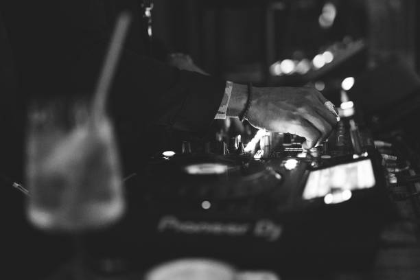 istock a DJ plays music on a controller at a party 1596623814