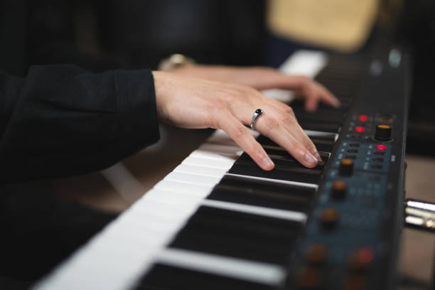 istock close-up of a pianist's hands while playing the piano 1596624340