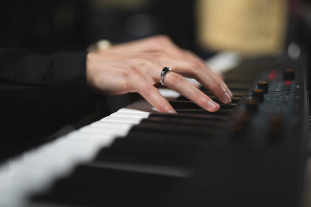 istock close-up of a pianist's hands while playing the piano 1596624858