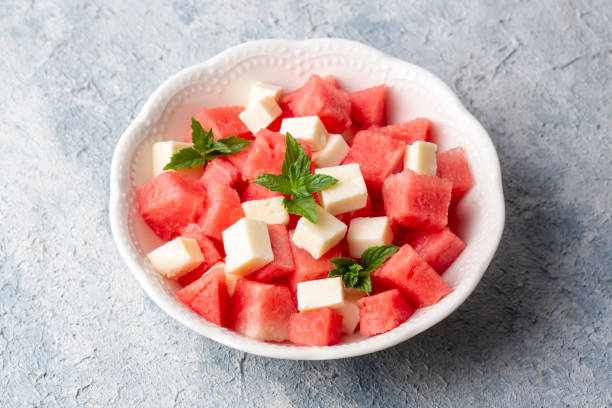istock Plate with Fresh Watermelon and Cheese 1596627542