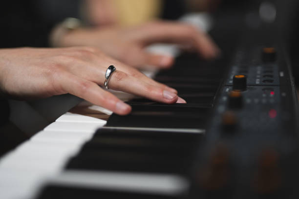 istock close-up of a pianist's hands while playing the piano 1596627579