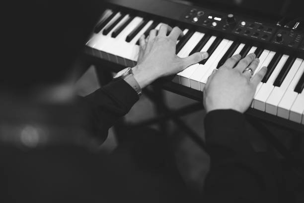 istock close-up of a pianist's hands while playing the piano 1596627580