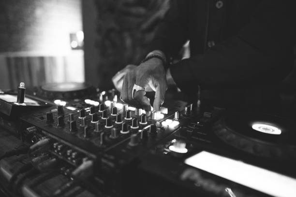 istock a DJ plays music on a controller at a party 1596628634