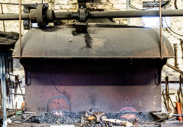 Cracked Wraught Iron Forge Hood At Combe Mill Cracked wraught iron forge hood at Combe Mill. burton sussex stock pictures, royalty-free photos & images