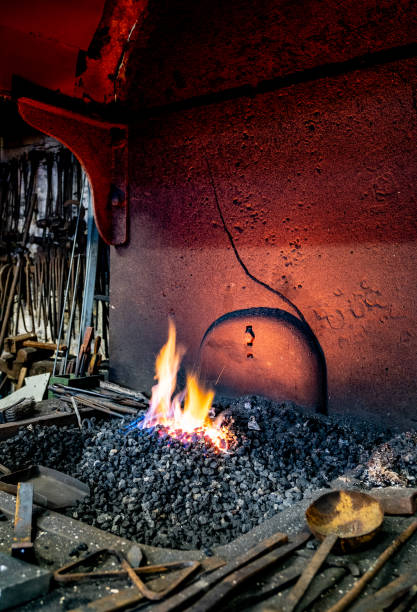 The Forge Fire At Combe Mill, Oxfordshire The forge fire at Combe Mill, Oxfordshire. burton sussex stock pictures, royalty-free photos & images