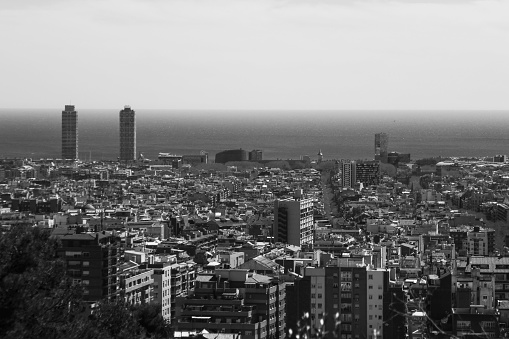 A grayscale shot of the beautiful skyline of Barcelona, Spain