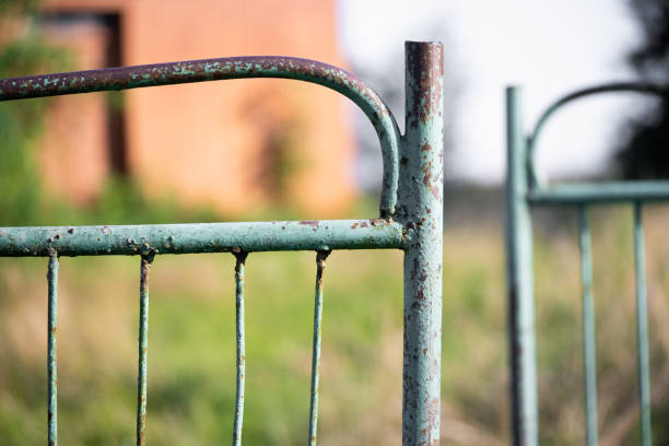 old rusty metal gate with cracked paint