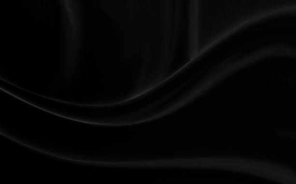 istock Black gray satin dark fabric texture luxurious shiny that is abstract silk cloth background with patterns soft waves blur beautiful. 1596683498