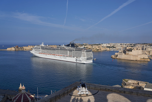 Valetta, Malta - June 11, 2023: Large cruise ship exiting the Grand Harbour at Valetta in Malta