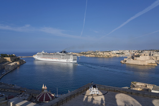 Valetta, Malta - June 11, 2023: Large cruise ship exiting the Grand Harbour at Valetta in Malta