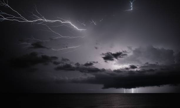 istock lightning and thunderbolts over the sea at night 1596748923