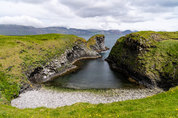 istock Pumpa viewpoint in Arnarstapi on the Snaefellsnes Peninsula in Iceland. A geological feature of a triangular ravine along the coast 1596782379