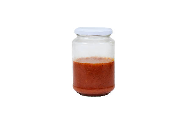 istock tomato sauce in glass bottle isolated on white with clipping path 1596797609