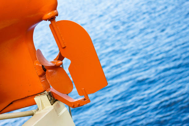 Propeller of boat motor on a background of blue sea.