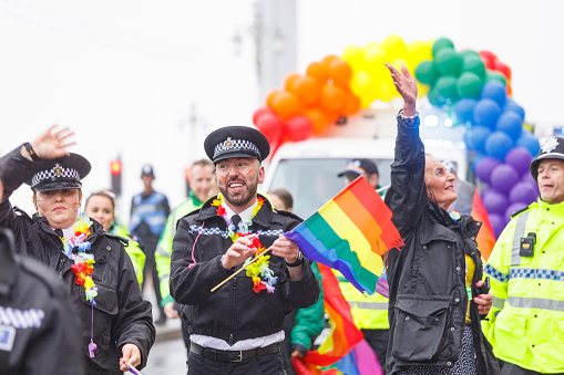 Brighton, England - August 5th 2023: Police at the pride parade. The Brighton & Hove Pride Parade 2023 begins in wet and rainy conditions on August 05, 2023, in Brighton, England.
