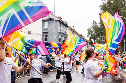 Brighton, England - August 5th 2023: UK Pride Colour Guard at the pride parade. The Brighton & Hove Pride Parade 2023 begins in wet and rainy conditions on August 05, 2023, in Brighton, England.