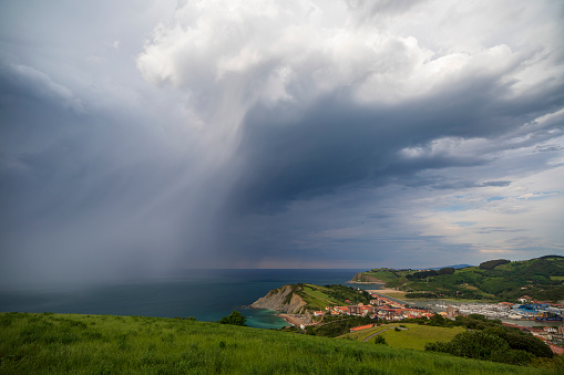 Storm clouds over Zumaia in the coast of Gipuzkoa Basque country Spain